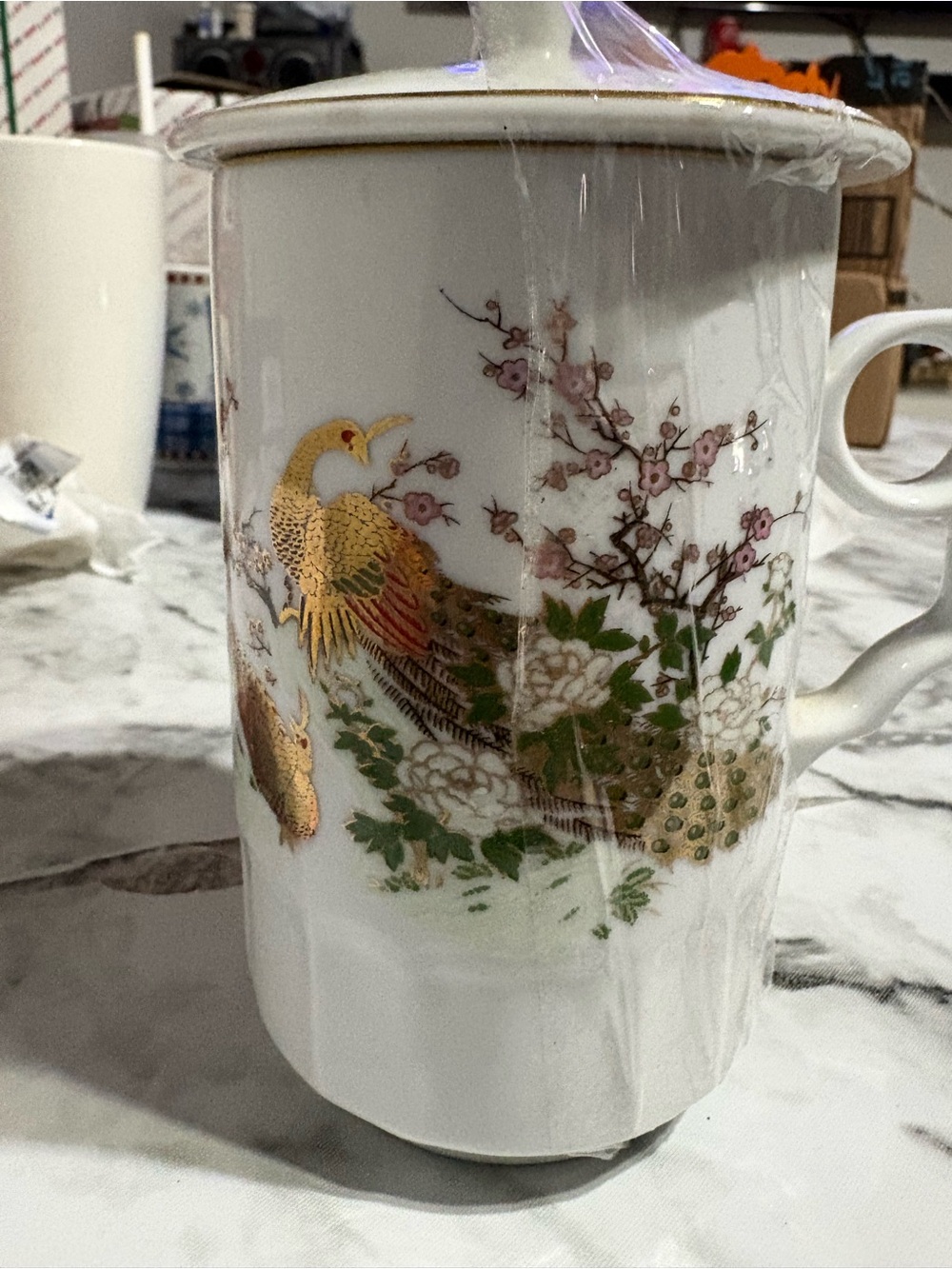 Beautiful porcelain mug with matching lid, made in Taiwan.